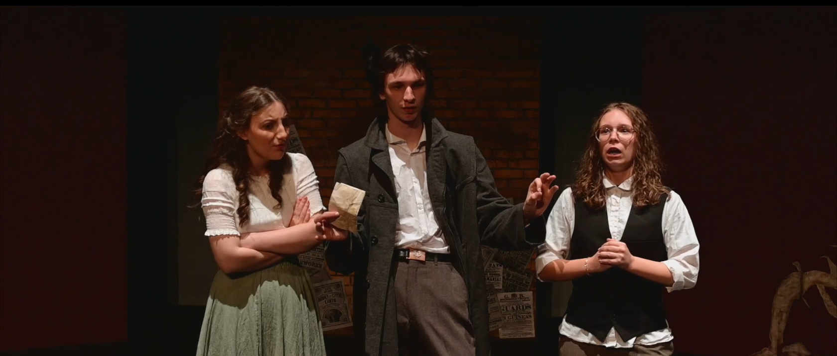A man standing between two women