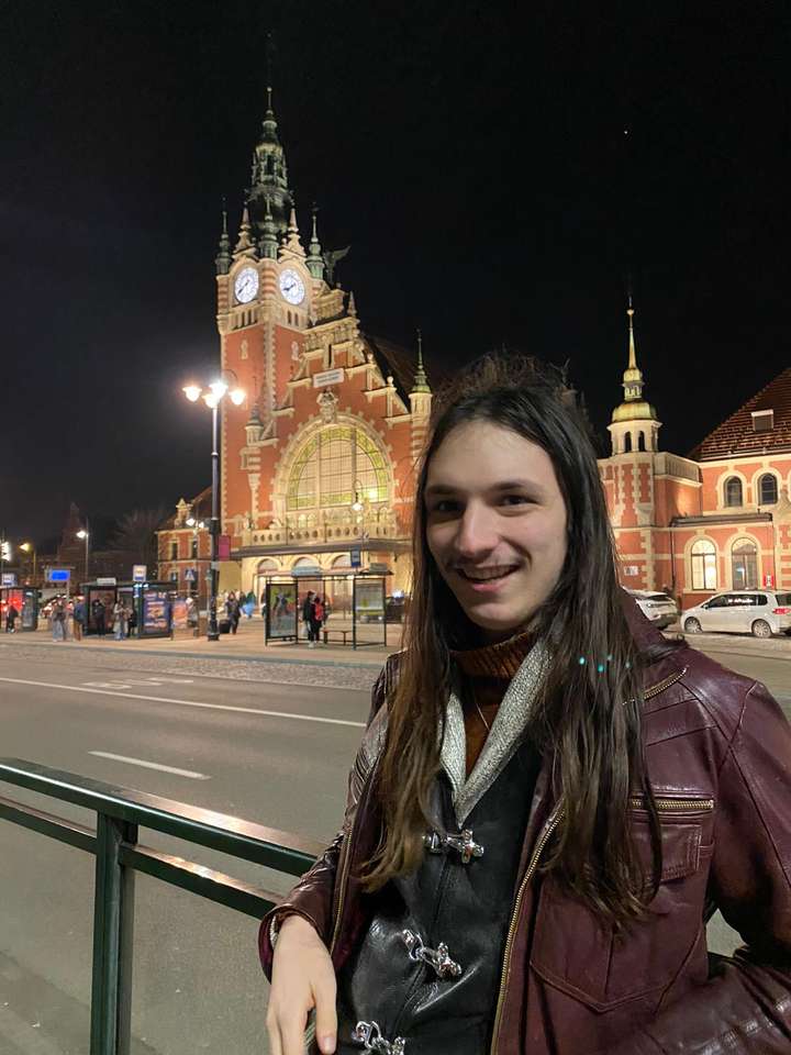 A man by a historic building