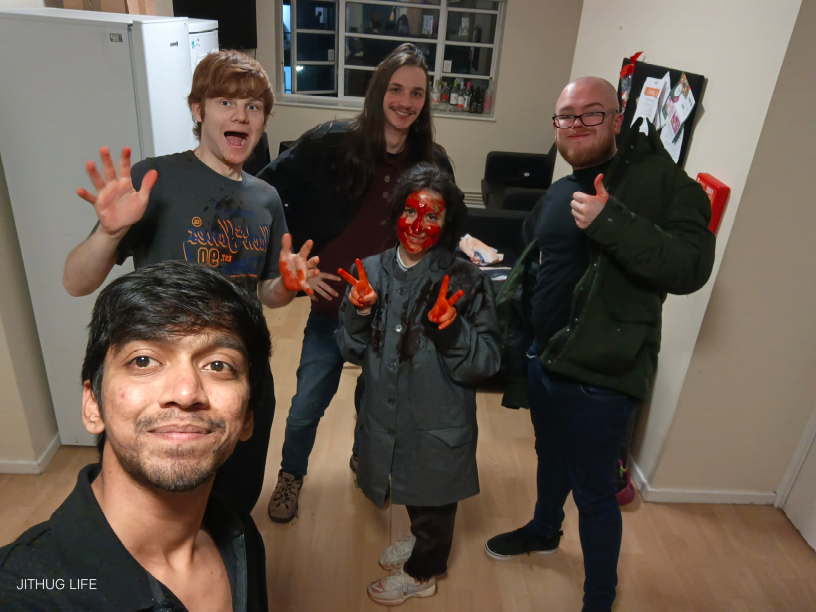 Four men and a very small woman covered in blood