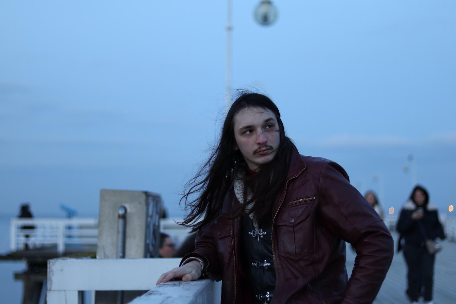 Joseph looking moody on a windswept pier